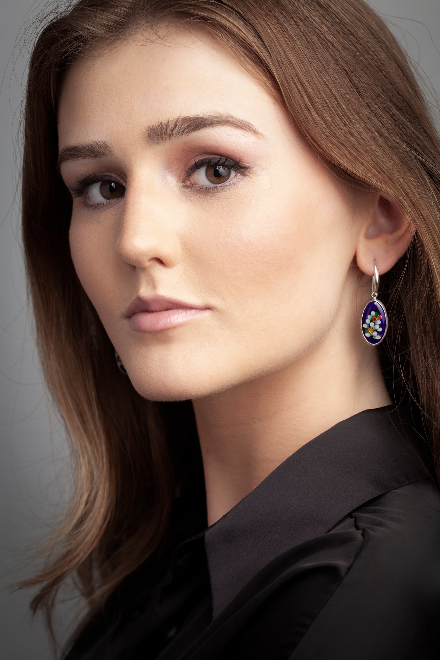 Blue oval earrings with floral designs