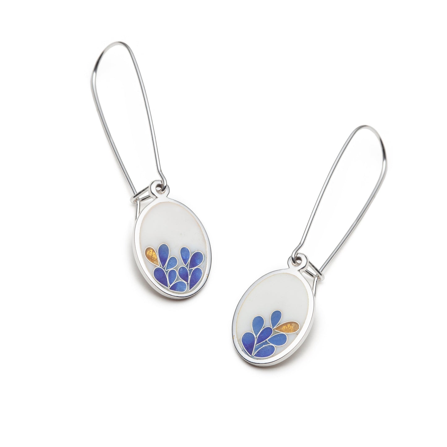 Pair of earrings with floral designs on a white background