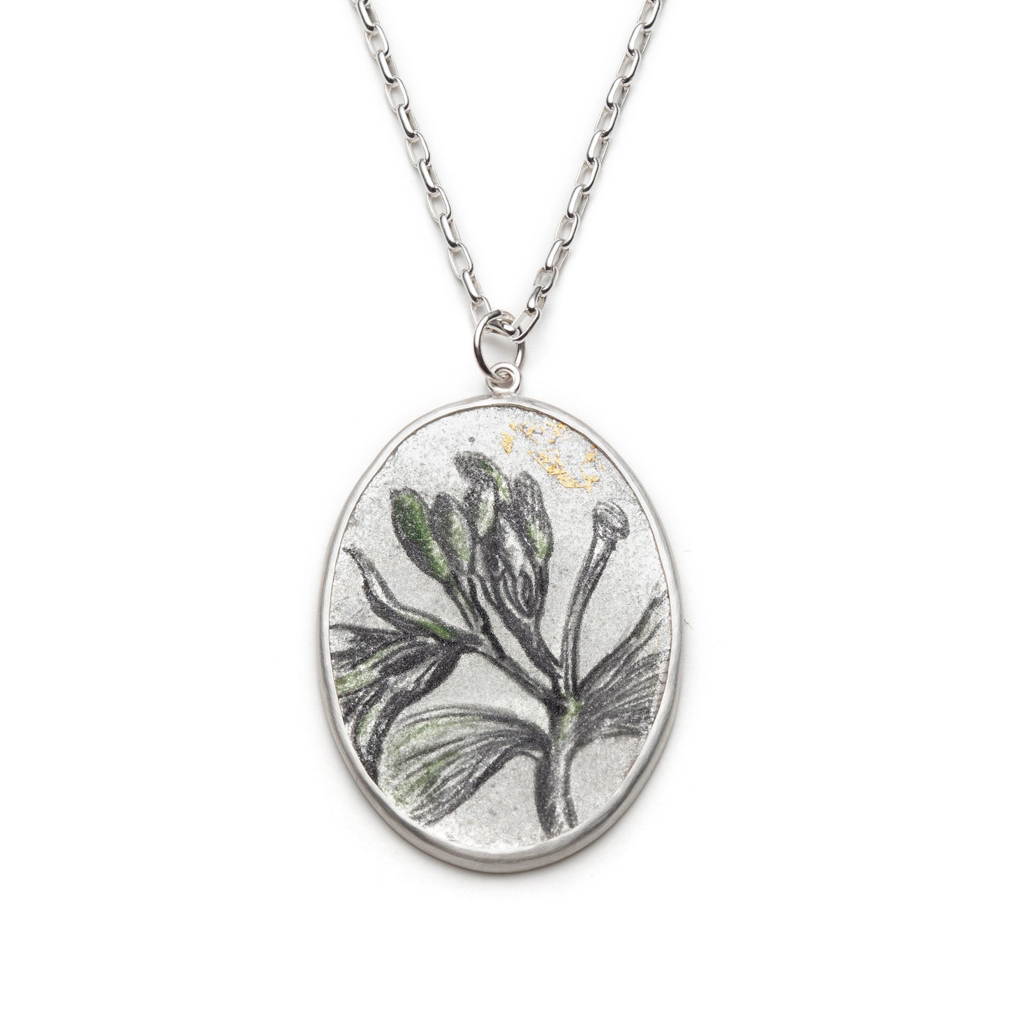 Necklace with a pendant featuring a leaf design on a white background