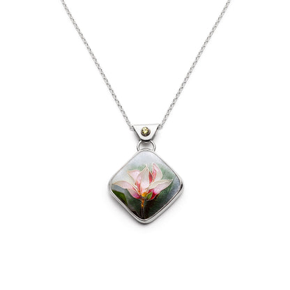 Necklace with a pendant featuring a floral design on a white background