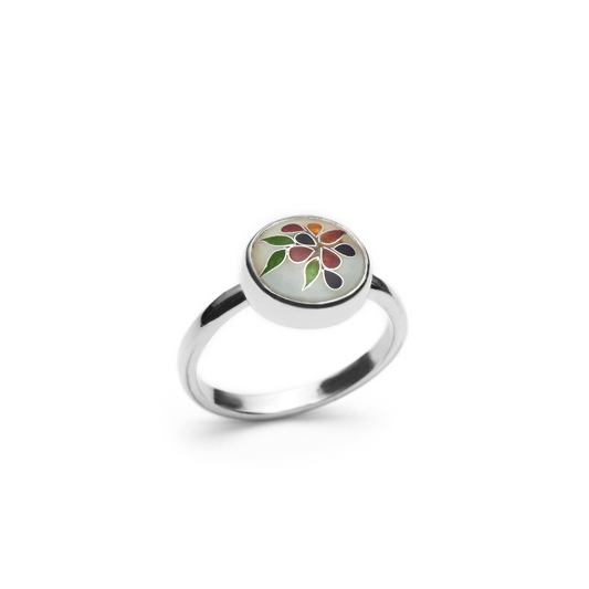 Silver ring with a colorful floral design on a white background