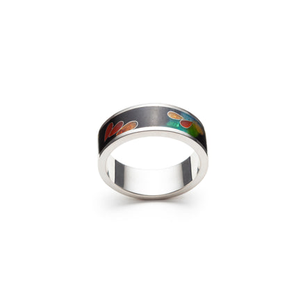 Silver ring with a colorful design on a white background