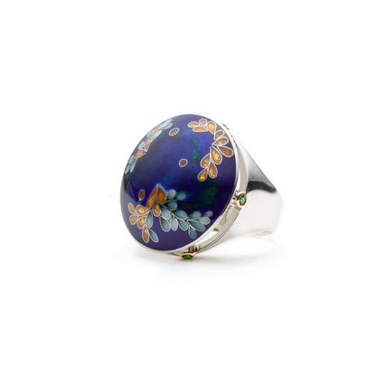 Ring with floral design on a blue background